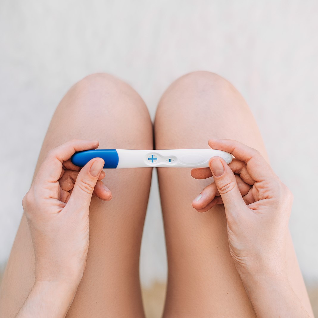 Free Pregnancy Tests A woman holding a free pregnancy test in Hampstead, North Carolina