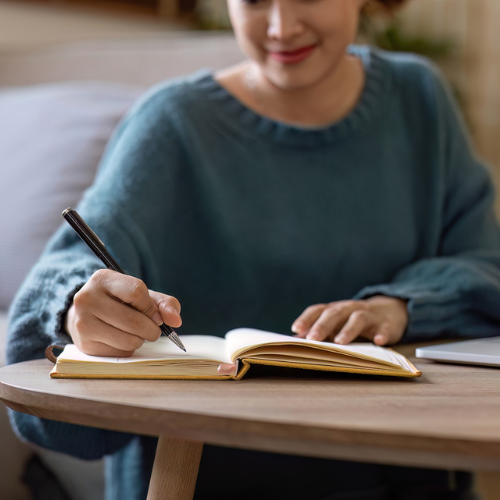 What’s the Difference Between Emergency Contraception and the Abortion Pill? Woman writing down the differences between emergency contraception and the abortion pill