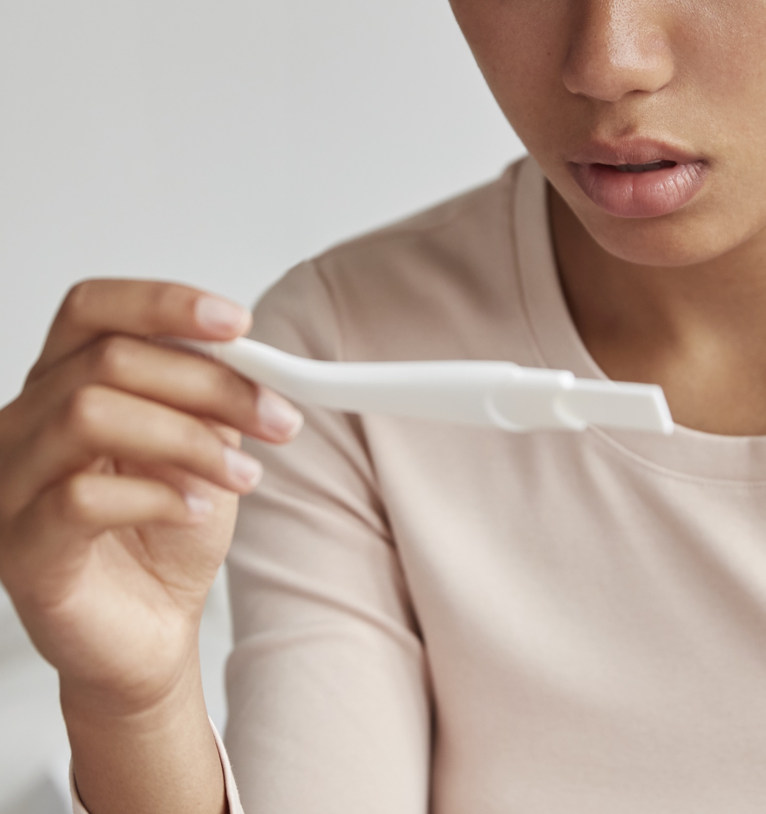 Pregnancy Tests A woman holding a free pregnancy test at Lauren's Hope
